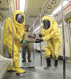 Delhi Fire Service personnel give a demonstration of firefighting technique during the Fire Service Week 2004 at Delhi Metro
