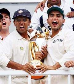 Indians celebrate their victory in the Test series as Danish Kaneria (L) and Asim Kamal of Pakistan walk back to the pavilion at the Pindi Cricket Stadium on Friday.