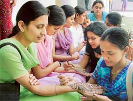 Students of various engineering colleges take part in mehndi contest during the techno-cultural festival at Guru Nanak Engineering College in Ludhiana