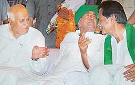 National Conference leader Farooq Abdullah, Haryana Chief Minister Om Prakash Chautala and Indian National Lok Dal candidate from Chandigarh Harmohan Dhawan share the dais at a public meeting at Nehru Park in Chandigarh on Sunday.