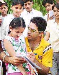 Yuvraj Singh with youngsters at the DAV Senior Secondary School ground, Sector 8, Chandigarh, on Sunday.
