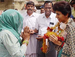 Congress candidate Kumari Selja interacts with residents of Rajjupur village near Ambala 