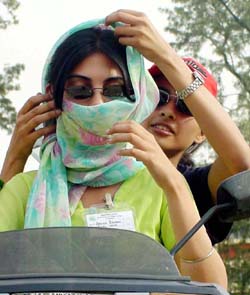 Harsh glare forces these damsels to cover their faces in Ludhiana