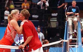 Australian tennis star Lleyton Hewitt kisses his fiance Kim Clijsters 