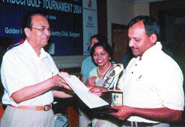 PHDCCI vice-president K N Memani presenting the golf trophy to NSG DIG Somesh Goyel at the Golden Greens Golf Club.