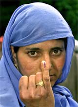 A woman shows her finger with a voting mark in Sheeri