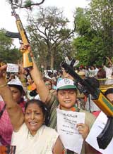 Congress activists protest against Mr L.K. Advani