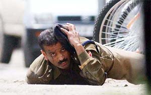 A CRPF officer lying on ground after being injured in a militant attack