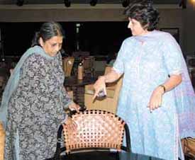 Mrs Manju Singh showing her cane exhibits to a customer at her exhibition which began at the Chinmaya Mission