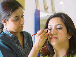 Neha Singh, L'Oreals make-over artiste, designs a clients look at L'Oreal studio in Chandigarh on Saturday.