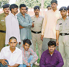 Three constables of the Chandigarh Police (in plain clothes) and three others, who were arrested on the charge of luring people to circulate fake currency notes. 