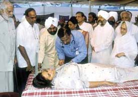 Baba Hardev Singh Ji Maharaj inaugurated a series of 101 blood donation camps in the Capital on Saturday. The photo shows his spouse, Pujya Mata Sawinder Ji, donating blood.