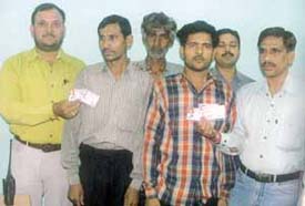 Three suspects involved in the driving licence racket.
