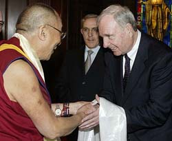 Canadian Prime Minister Paul Martin receives a scarf from the Dalai Lama in Ottawa on Friday. 