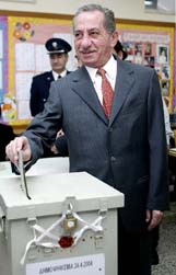 Greek Cypriot President Tassos Papadopoulos caste his vote in Cypruss reunification referendum on Saturday.