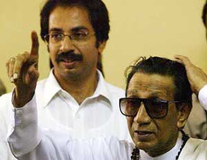 Shiv Sena Supremo Bal Thackeray gestures to the crowd after casting his vote