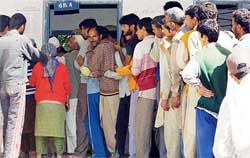 People wait for their turn to cast their vote