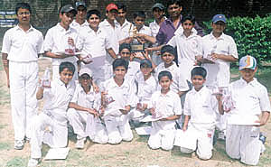 The Bal Bharati School (Pitampura) cricket team with principal S. C. Baveja after they annexed the Pankaj Jain Cricket Tournament title.