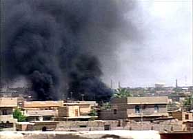 A video grab image shows smoke rising in the turbulent Iraqi town of Falluja