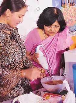 Tarla Dalal cooks a recipe at a cookery competition in Chandigarh on Tuesday