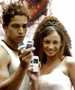 Two Indian models pose with just-launched Nokia mobile phones during the CDMA summit in Mumbai on Wednesday.