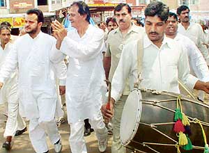 Mr Harmohan Dhawan, INLD candidate for the Chandigarh Lok Sabha seat (with folded hands), during his campaign in Sector 26 Grain Market, Chandigarh, on Wednesday.