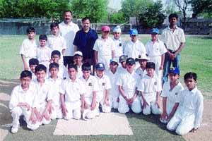 Frank Anthony School principal Stephen DCosta and former Delhi player Sunil Sudan with the teams before the start of the Master Cup Under-10 Cricket Tournament.