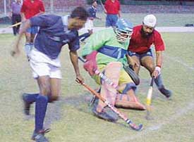 Teams of the CISF and Ambala XI vie with each other in Dharam Singh Memorial six-a-side hockey tournament at the Sector 18 hockey stadium in Chandigarh on Thursday. 