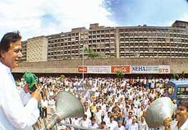 INLD candidate Harmohan Dhawan addresses an election rally outside the Punjab and Haryana Secretariat in Chandigarh on Thursday.