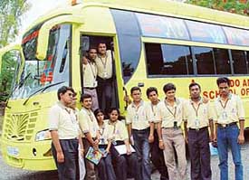Students of the Indo-American School of Business outside their mobile classroom in city on Thursday. 