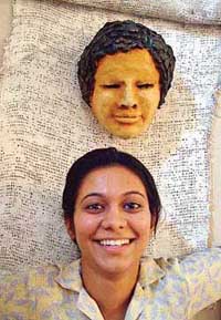 A final-year student of the Sculpture Department of Government College of Art, Sector 10, with her creation at the college campus in Chandigarh on Thursday.
