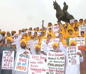 Members of the Sikh Nation Organisation raise slogans against the ban on the turban in French schools