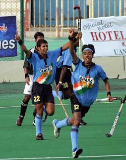Indian players celebrate after scoring a goal against Pakistan 