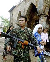 A Thai soldier stands guard outside Krue Se mosque in Thailands largely Muslim province of Pattani, 1,150 km south of Bangkok