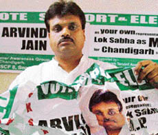 Mr Arvind Jain, an Independent candidate, shows his poll material torn by Election Office officials from shops in Chandigarh on Thursday.