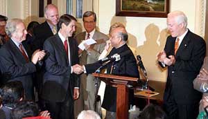 Senate majority leader Bill Frisk with other Senators congratulating Indian Ambassador Lalit Mansingh