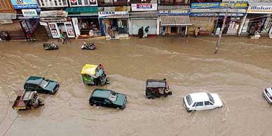 Vehicles seen trapped in the water-logged Hari Singh High Street