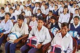 Students of government schools are all smiles after receiving books and school dress from the Vasudhaiva Kutumbakam, at DAV College, Sector 10, Chandigarh, on Saturday. 