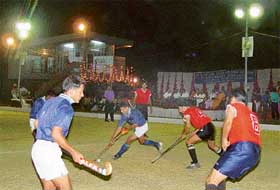 The first semi-finals of the second Dharam Singh Memorial six-a-side hockey tournament between the CISF and Rock Rovers being played under the floodlights in the Sector 18 hockey stadium on Monday.