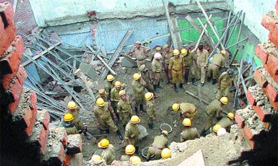 Delhi firepersons in the well of the commercial building which collapsed in the Sadar Bazar area in the Capital