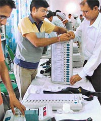 Officials of the Election Department seal electronic voting machines in Chandigarh on Tuesday.