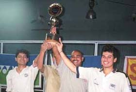 The IMRB team, who bagged the Inter-Corporate Badminton Tournament title, with their trophy