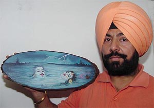 Punjab Police Head Constable Balram Chand with one of his works. 