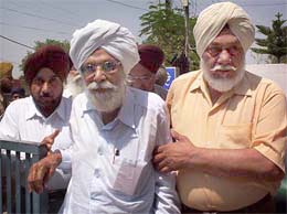 CPM leader Harkishan Singh Surjeet being helped by his close friend to Patiala Heart Institute for checkup on Wednesday. 