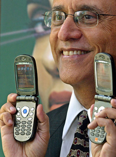 A senior official of Motorola displays new Motorola MPx200 handsets during a news conference