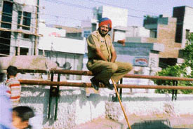 A cop takes a breather during his shift on a busy road 