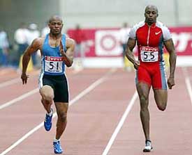 Maurice Greene of the US runs ahead of compatriot JJ Johnson to win the men's 100m final 