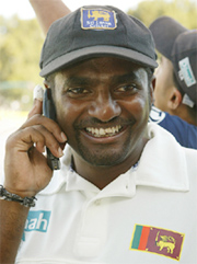 speaks to the West Indies paceman Courtney Walsh over the phone following the match