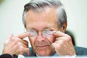 Near the end of a long day of testifying, US Secretary of Defence Donald Rumsfeld wipes his eyes