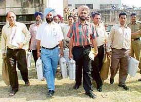 Officials go to polling booths after receiving election material at Government  College, Sector 46, Chandigarh